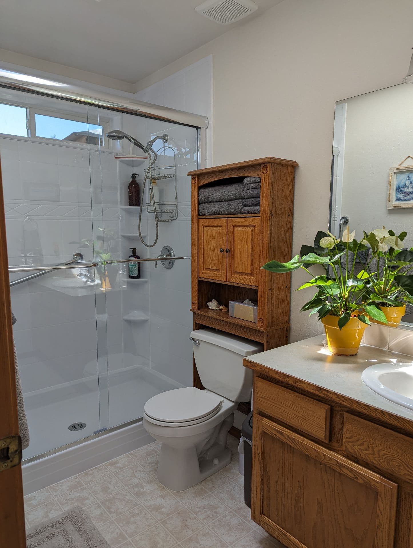 Clean bathroom with walk-in shower